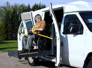 elderly man inside medical van