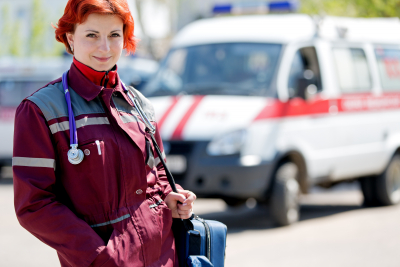 female paramedic with ambulance