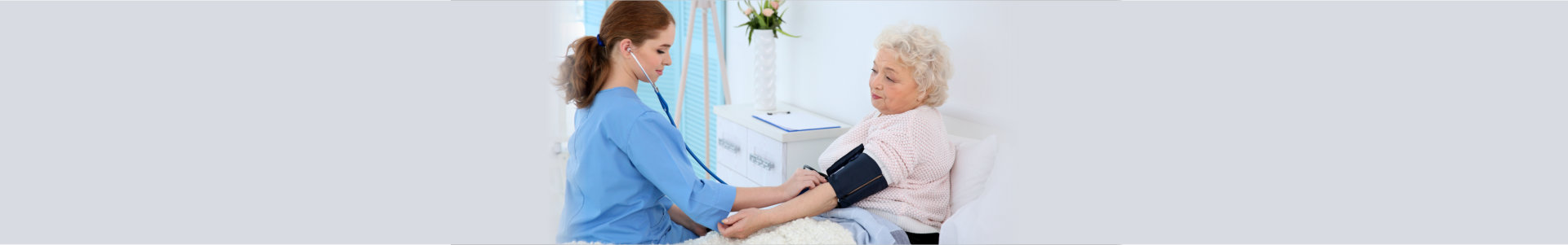 Nurse having attending an old woman